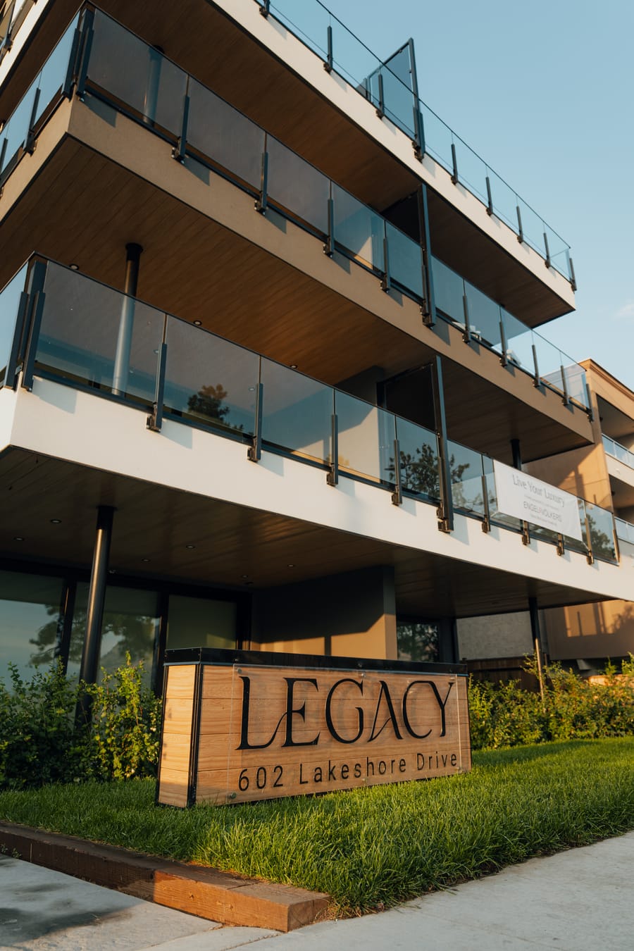 Stacked glass-railed balconies on the lake side of Legacy on Lakeshore